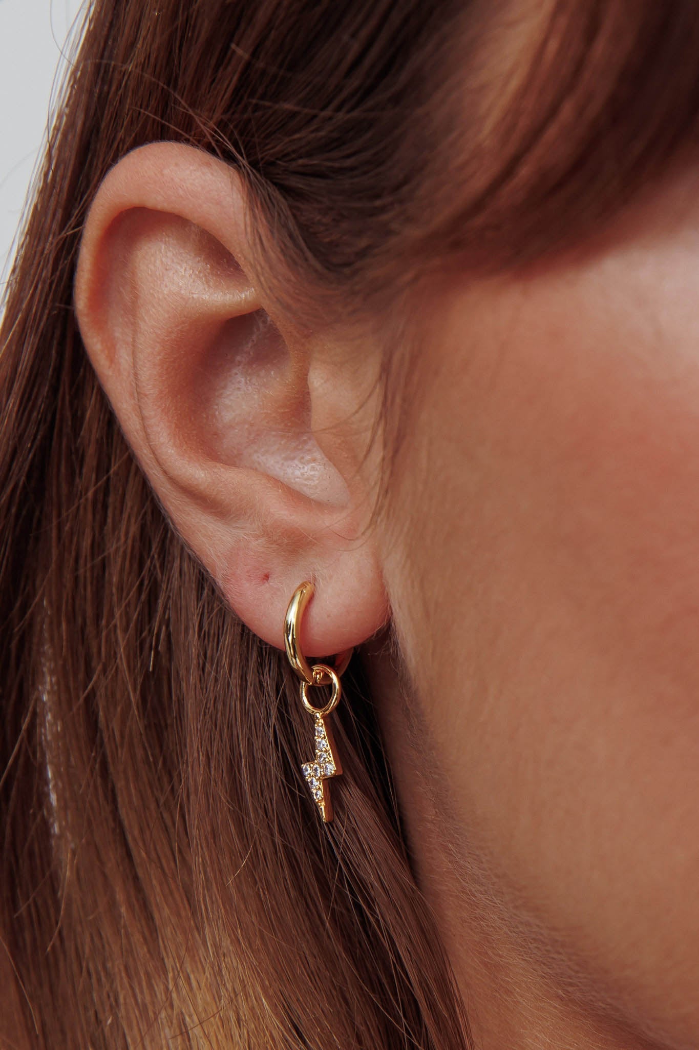 Celeste Lightning Zircon Earrings Gold